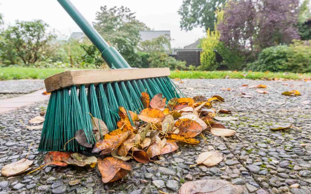 fall maintenance includes task like sweeping up fallen leaves