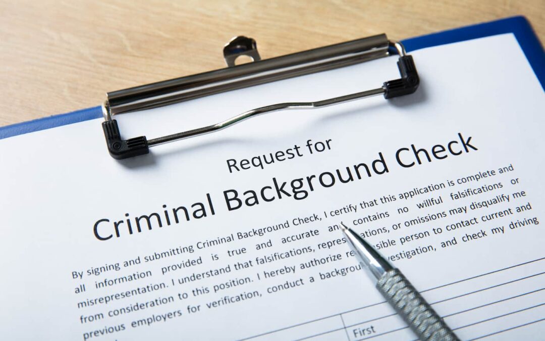 A clipboard holding a form for criminal background checks